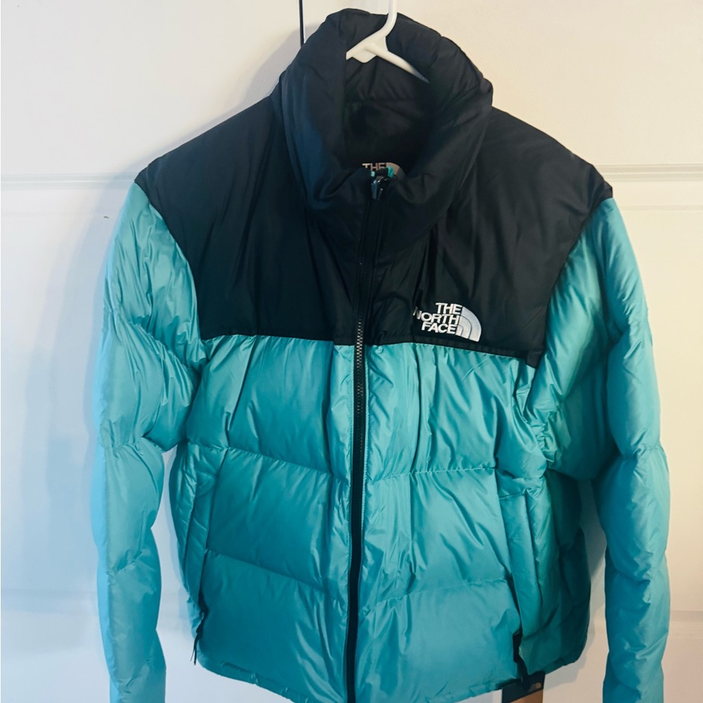 The North Face Woman’s Black and Teal Puffer Jacket